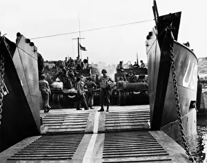 01205 Prints: A U.s army loadmaster seen here directing load operations of American armour on to a