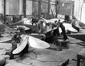 00531 Prints: Using pneumatic chisels these workmen are seen cutting surplus metal off newly cast