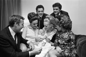 01053 Prints: Val Doonican and his wife Lynn in supporting roles at the christening of baby Russell
