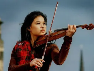 Classical Prints: Vanessa Mae at Edinburgh Castle playing violin wearing tartan 1996