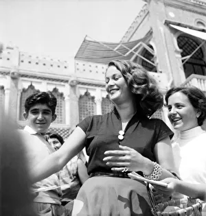 Venice Film Festival 1953. Italian film actress Jaqueline Collard being mobbed by