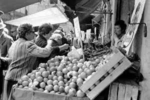 Fruit Prints: Venice, Italy, Venetians out food shopping at a local market. April 1975 75-2202
