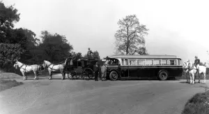 00074 Prints: The Venture stagecoach standing next to its modern day equivalent a Venture coach or bus
