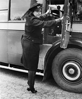 Veteran driver of the Oxford Bus Company Miss Rosalind Williams getting into her cab for