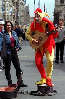 Vicky Davidson Sunday Mail reporter August 1999 looking at busker Fester at the Edinburgh