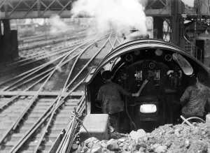 00390 Prints: View over the cab of a Southern railways express train making its way from Waterloo to