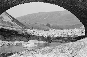 Rocks Prints: A view underneath a stone bridge at Glen Roy in Invernesshire in the Highlands of