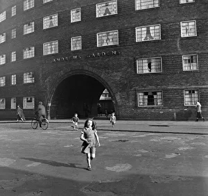 00123 Prints: Views of Liverpool, 13th May 1954. Young girl outside St Andrews Gardens housing
