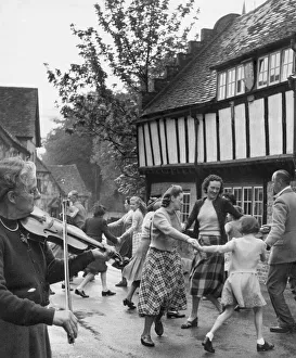 Village Fete. Miss Isabella Geddis plays her 200 year old fiddle for the residents of