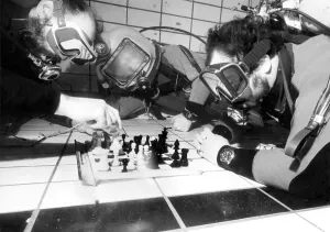 Divers Prints: Vince Rice acts as referee for divers Fred Earl and Terry Hart during the underwater