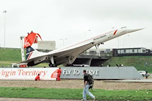 Virgin Group staff hijacking the British Airways Concorde model that stands