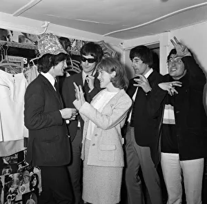 Virginia Campbell meets British rock group The Kinks at a dress shop in Kennington