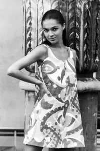 Sexy Prints: Virginia North modelling beach fashion - wearing a print mini dress standing with one