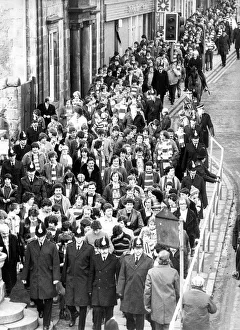Scarves Prints: Visiting fans being escorted to St. Jamess Park for the Saturday afternoon match in