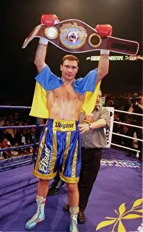 Medals Prints: Vitali klitschko holding up the WBO world heavyweight belt after knocking out britians