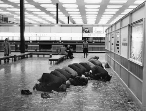 While they wait for their flight, Moslem pilgrims bound for Mecca take their shoes off