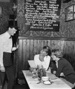 Serving Prints: Waiter John Hughes serving customers at the Contented Sole