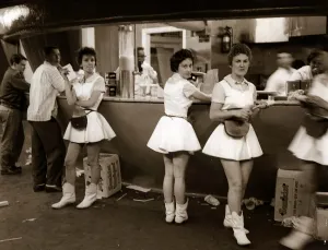 Eating Out Prints: waitresses and waiters in a fast food restuarant mini skirts boots USA