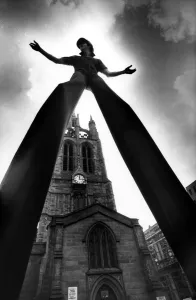 00496 Prints: Walking Tall! World champion stilt walker John Long set some heads turning when he went