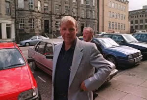 01414 Collection: Wallace Mercer former Hearts football chairman standing in street