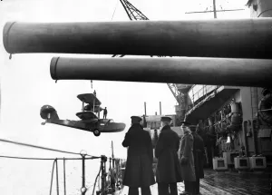 01442 Prints: A Walrus aircraft returning from patrol is picked up and hoisted aboard battleship HMS