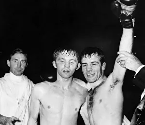 Walter McGowan boxer arm raised celebrates winning victory arm around opponent flyweight