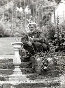 Fishing Rod Prints: Walter Sherratt, aged 67, is posing as a garden gnome in his garden at Biddulph