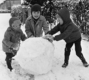 00755 Collection: Do you want to build a snowman? Three children seen here in Reading take advantage of