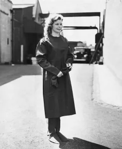 Protective Prints: War munition workers. A lady in her thick rubber protective overall