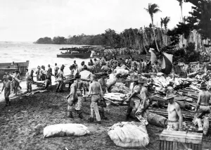 Pacific Theatre Prints: War in the Pacific. Allied soldiers unload supplies and equipment onto the beach of a