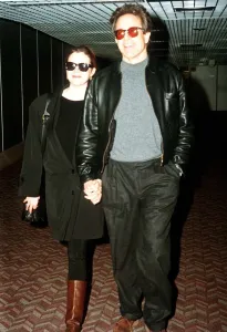 Stars Prints: Warren Beatty actor with wife Annette Bening actress arrive at Heathrow airport