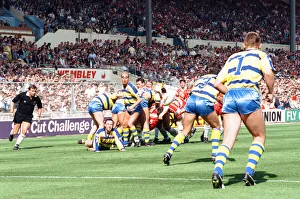 00351 Prints: Warrington desperately clear their lines from deep within their own half during the Rugby