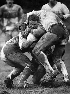 Warrington v St. Helens. Carl Webb tackled for the ball by Saints players on each