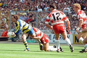 00351 Prints: Warringtons Paul Bishop gets the ball away just as the Wigan defence close him down