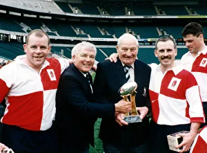 Warwickshire match secretary Harry Walker celebrates with the CIS Insurance Country