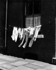 Drying Prints: A washing line near a terrace house in Manchester Circa 1955