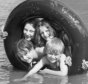 Swimming Costumes Prints: Water, sun and an old tyre... what more could one ask? Having fun at Binley Road paddling