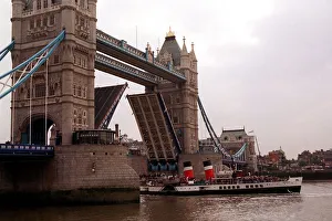 Waverley ferry sailing below the Tower Bridge to celebrate her 50th birthday crowds cheer