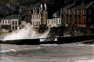 Waves Prints: Waves crash against a wall at Millport in Scotland after heavy winds caused the sea to