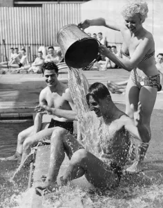 One way to cool off in the present heat wave is to have a bucket of cold water thrown