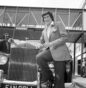 Rolls Royce Prints: Wayne Newton looking very happy as he leans against a gleaming Rolls-Royce on his arrival
