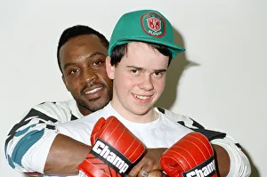 Former WBO middleweight champion Nigel Benn with boxer Richard Ross. 6th March 1990