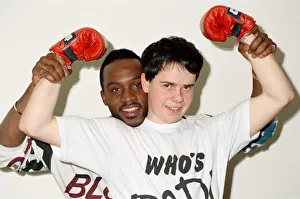 01160 Prints: Former WBO middleweight champion Nigel Benn with boxer Richard Ross. 6th March 1990