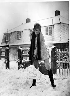 Winter Prints: Weather - 17th Dec 1969 - Mrs Gwen Evans clears the snow with her shovel after Wales