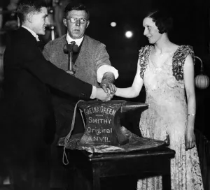 Blacksmith Prints: A wedding over the anvil with the actual Gretna Smith officiating at the press Ball
