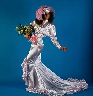 Images Dated 15th June 1986: Wedding dress fashion, June 1986 Model wearing pink satin dress