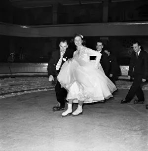 Skating Prints: Wedding on ice for ice hockey player Bill Winamaskers seen here on the ice with his Bride