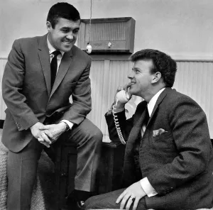 00254 Prints: Two wee men with big grins. And no wonder. Billy Bremner has just heard the news that his