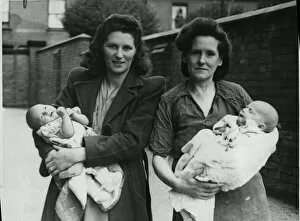 01438 Collection: Three weeks old Raymond Ratford, the youngest evacuee, photographed with the mother