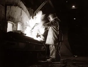 00133 Prints: A welder wearing a suit designed to keep you cool at temperatures of 500 degrees